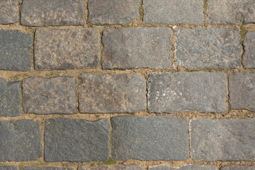 Ancient paving road in the center of the city close up