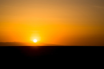 Sunset or sunrise over the Sahara Desert
