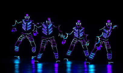 dance team in costumes of the LEDs