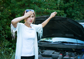 Grieving girl tries to repair a broken car