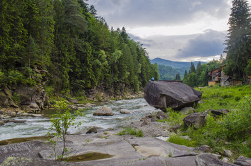 Guy meditates in a beautiful place on the rock