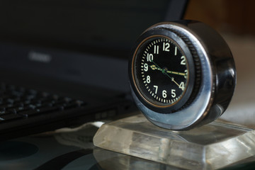 Clock and laptop