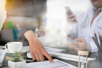 Doctor hand working smart phone Doctor explaining patient's illness and treatment time, sun flare effect photo Medical technology network