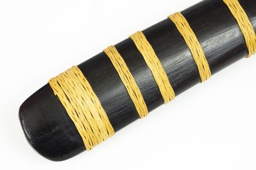 The ancient Thai pod handle black with thousands of rattan brown on white background. Ancient...