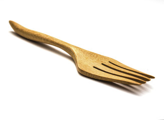 wooden fork on white isolate.