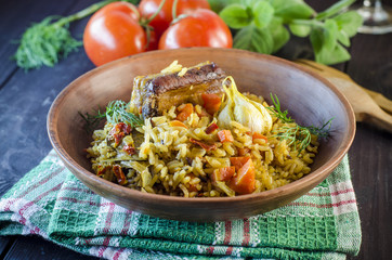 Pilaf on a platter with meat and spices