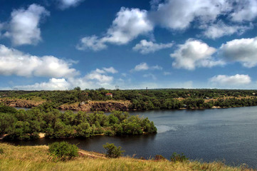 Summer landscape with green tree and blue sky