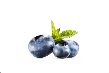 pile of blueberries with mint leaves