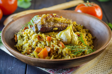 Pilaf on a platter with meat and spices