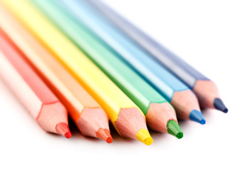 Fototapeta premium Color pencils isolated on white background. Many different colored pencils. Colored drawing pencils in a variety of colors