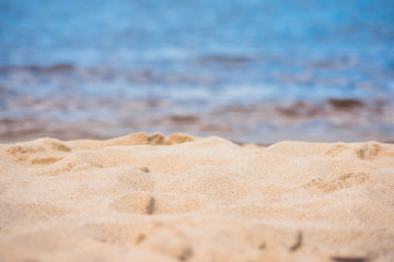 Fototapeta na wymiar selective focus of tranquil empty sandy beach at daytime