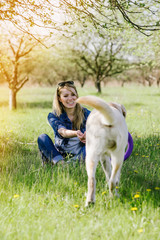 Woman playing with a retriever