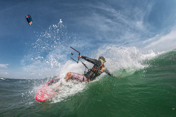 Kiter rides board