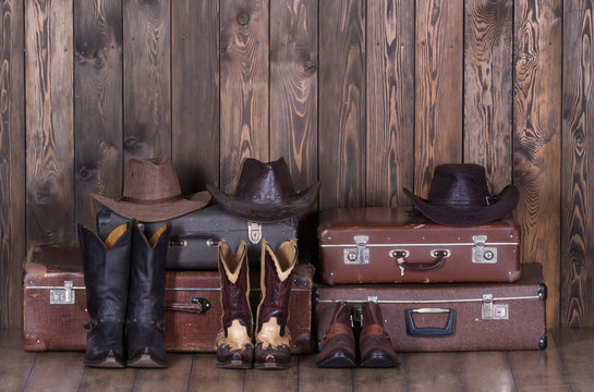 Old suitcases, hats and cowboy shoes