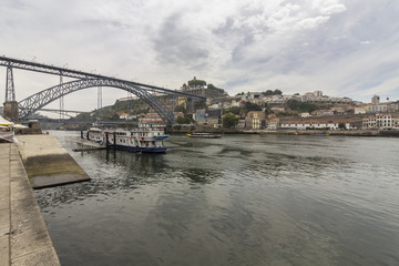 View of Ribeira historical quarter, on the margin Douro river embankment Oporto old town and  Luis I bridge, Porto.