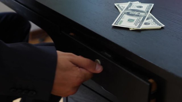 corruption, bribery and fraud concept - close up of businessman taking money. 4k, slow motion