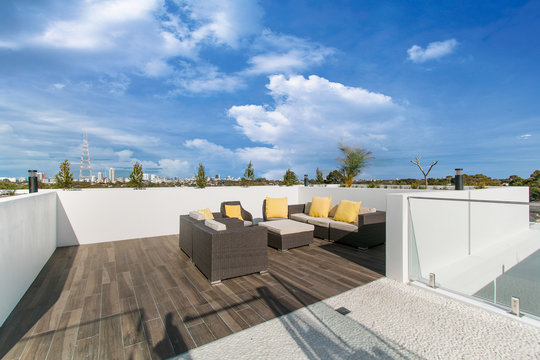 Outdoor terrace on the roof with garden furniture