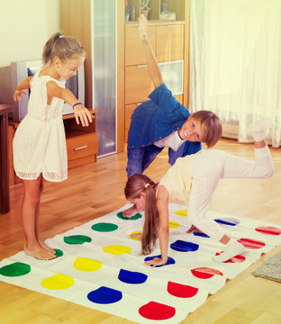 Children Playing Twister At Home.