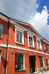 Old red building with blue sky.
