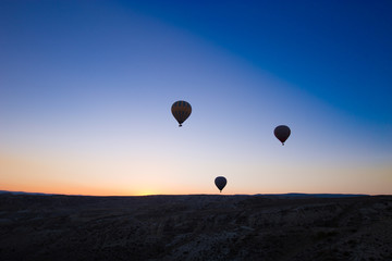 Colorful hot air balloons flying over the valley at Cappadocia,Anatolia,Turkey.The great tourist attraction of Cappadocia best places to fly with hot air balloons.NEVSEHIR/TURKEY- JULY 23,2016