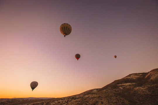 Colorful hot air balloons flying over the valley at Cappadocia,Anatolia,Turkey.The great tourist attraction of Cappadocia best places to fly with hot air balloons.NEVSEHIR/TURKEY- JULY 23,2016