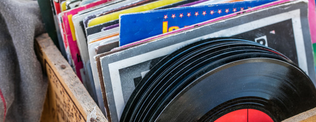 garage sale display of LPs and vinyls for music collectors