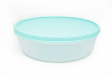 Plastic food container with blue lid isolated