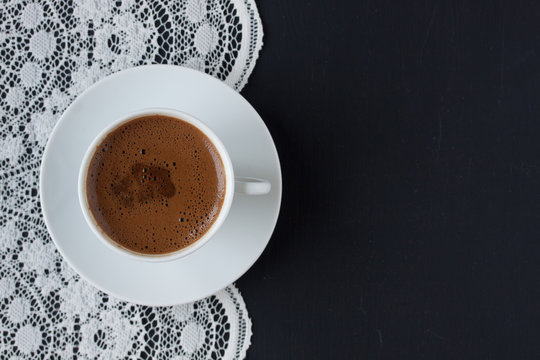 Turkish coffee on a lace and black background