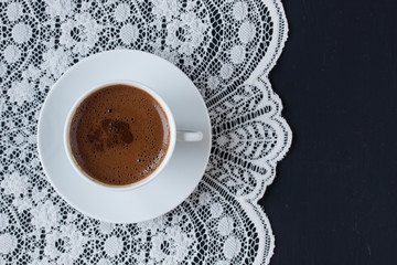 Turkish coffee on a lace and black background