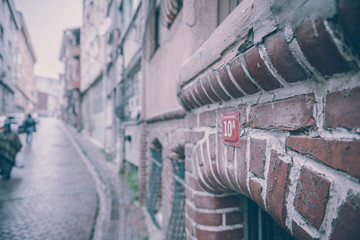 ISTANBUL, TURKEY - May 6, 2017: Vintage view of Traditional street and houses  at balat area.Street view in historical Balat district. Balat is popular attraction in Istanbul.