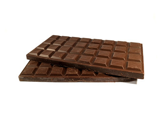 Two piled up chocolate bars isolated on white background, with free space for design and text 