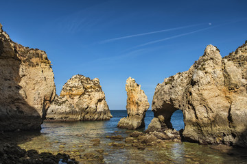 Fototapeta na wymiar Ponta da Piedade - unique rock formation in the Atlantic ocean. Famous tourist attraction in Lagos, Portugal 