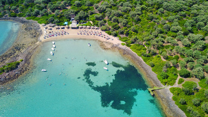 Aerial drone photo of Monolia island exotic beach with sapphire and turquoise clear waters, called the "Seychelles" of Greece, Lihadonisia island complex, North Evoia gulf, Greece