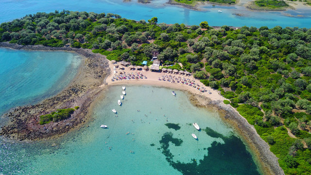 Aerial drone photo of Monolia island exotic beach with sapphire and turquoise clear waters, called the "Seychelles" of Greece, Lihadonisia island complex, North Evoia gulf, Greece