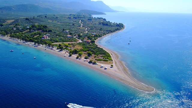Aerial drone photo of Monolia island exotic beach with sapphire and turquoise clear waters, called the "Seychelles" of Greece, Lihadonisia island complex, North Evoia gulf, Greece