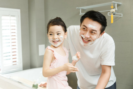 Father and daughter in bathroom