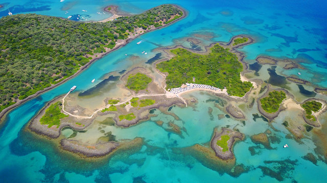 Aerial drone photo of exotic beaches with sapphire and turquoise clear waters, called the "Seychelles" of Greece, Lihadonisia island complex, North Evoia gulf, Greece