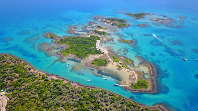 Aerial drone photo of exotic beaches with sapphire and turquoise clear waters, called the "Seychelles" of Greece, Lihadonisia island complex, North Evoia gulf, Greece