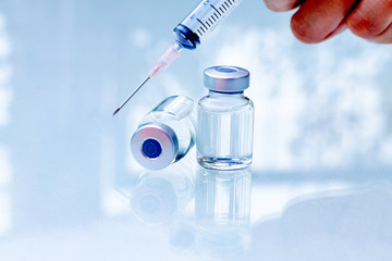 Syringe, medical injection Liquid drug or narcotic in hand.