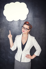 Woman in glasses showing on something by finger