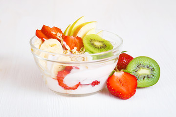 Yogurt with exotic fruits on a white background in the studio.