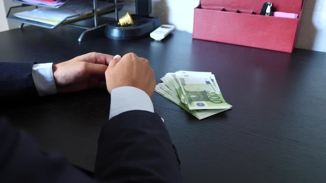 corruption, bribery and fraud concept - close up of businessman taking money. 4k, slow motion
