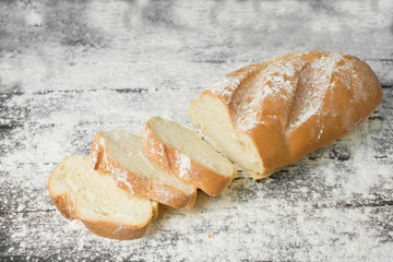 Loaf in flour on the table