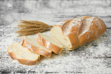 Loaf in flour on the table