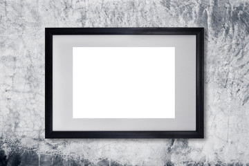 Black photo frame on concreate wall background.