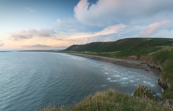 Editorial Swansea, UK - July 23, 2017: Rhossili Bay at the far tip of the Gower peninsula, showing The Old Rectory, possibly the most photographed house in Wales, UK