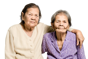 Portrait of senior asian women hugging her sister. Isolated on white background with  clipping path