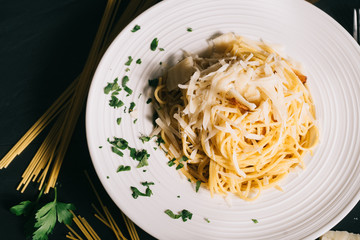 top view of italian cuisine carbonara pasta. Details of ingredients and close up of dish
