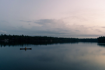 Obraz na płótnie Canvas A boat in a river/lake in Kerala.