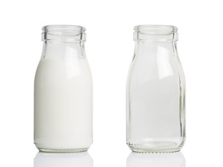 Two Glass Milk Bottles and without Cap, and one is empty.